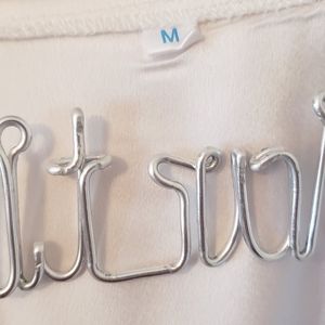 White satin robe with Peach embroidered "M". Size medium with lace sleeves/hem